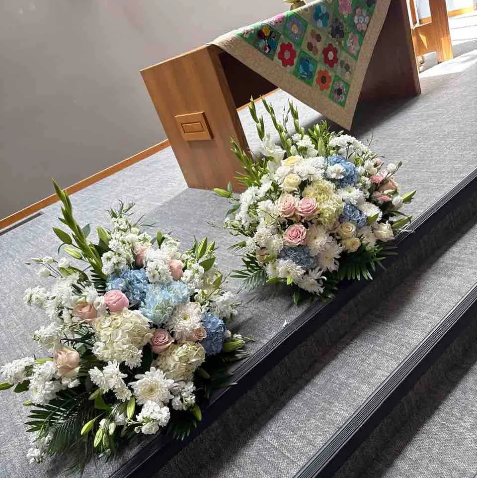 Funeral pastel casket flowers