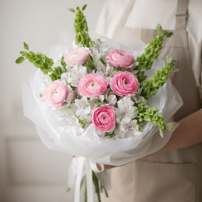 Mother’s Day bouquet with blush pink flowers, white blooms, and tall green stems in a modern arrangement
