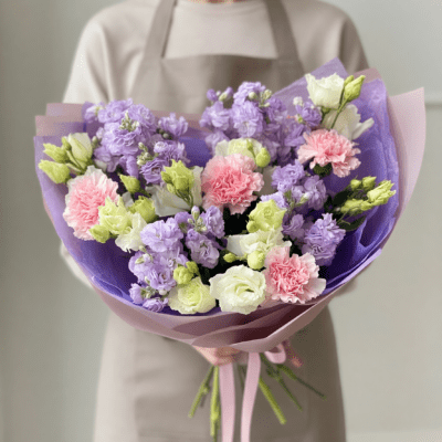 Lavender and blush Mother’s Day bouquet with pastel purple, pink, and white flowers wrapped in soft lilac paper