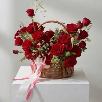 Rose basket Vancouver arrangement available in pink, white, peach, light pink and red roses with greenery and delicate white accents