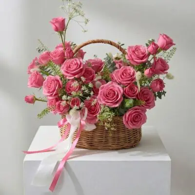 Rose basket Vancouver arrangement available in pink, white, peach, light pink and red roses with greenery and delicate white accents