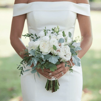 eucalyptus, dusty miller, and fresh greenery in a romantic bridal arrangement.