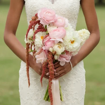 Pink Wedding Bouquet with blush ranunculus, white dahlias, garden roses, spray roses, and cascading amaranthus in boho style flowers