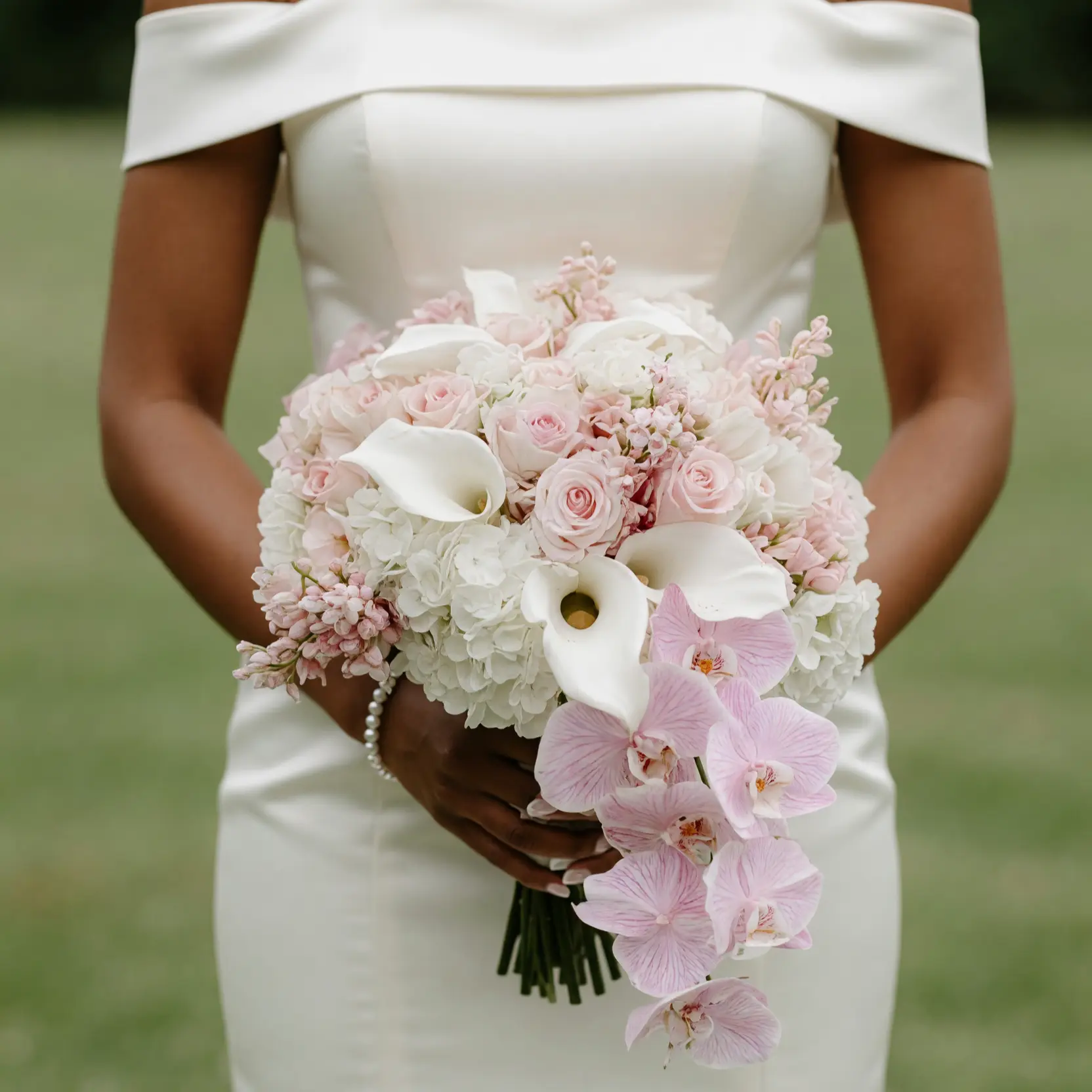 Pink Wedding Bouquet with blush roses, white hydrangeas, calla lilies, pink orchids, and elegant bridal flowers bouquets