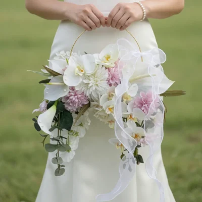Pink Wedding Bouquet bridal flowers bouquets floral hoop with white orchids, calla lilies, blush chrysanthemums, eucalyptus, and flowing organza ribbons