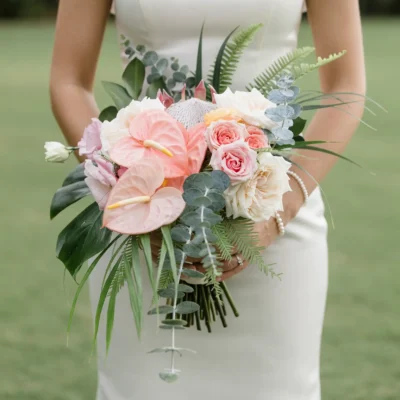 Pink Wedding Bouquet bridal flowers bouquets with blush anthuriums, king protea, garden roses, eucalyptus, tropical leaves, and palm foliage