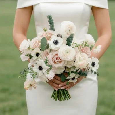 Anemone Wedding Bouquet featuring blush roses, white anemones, ivory ranunculus, eucalyptus, and elegant bridal flowers bouquets.