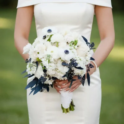 Popular wedding bouquets featuring a white Anemone Wedding Bouquet with hydrangeas, roses, dark foliage, and elegant bridal flowers.