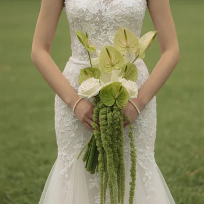 Green Wedding Bouquets with green anthuriums, white roses, cascading green amaranthus, and elegant modern botanical bridal flowers