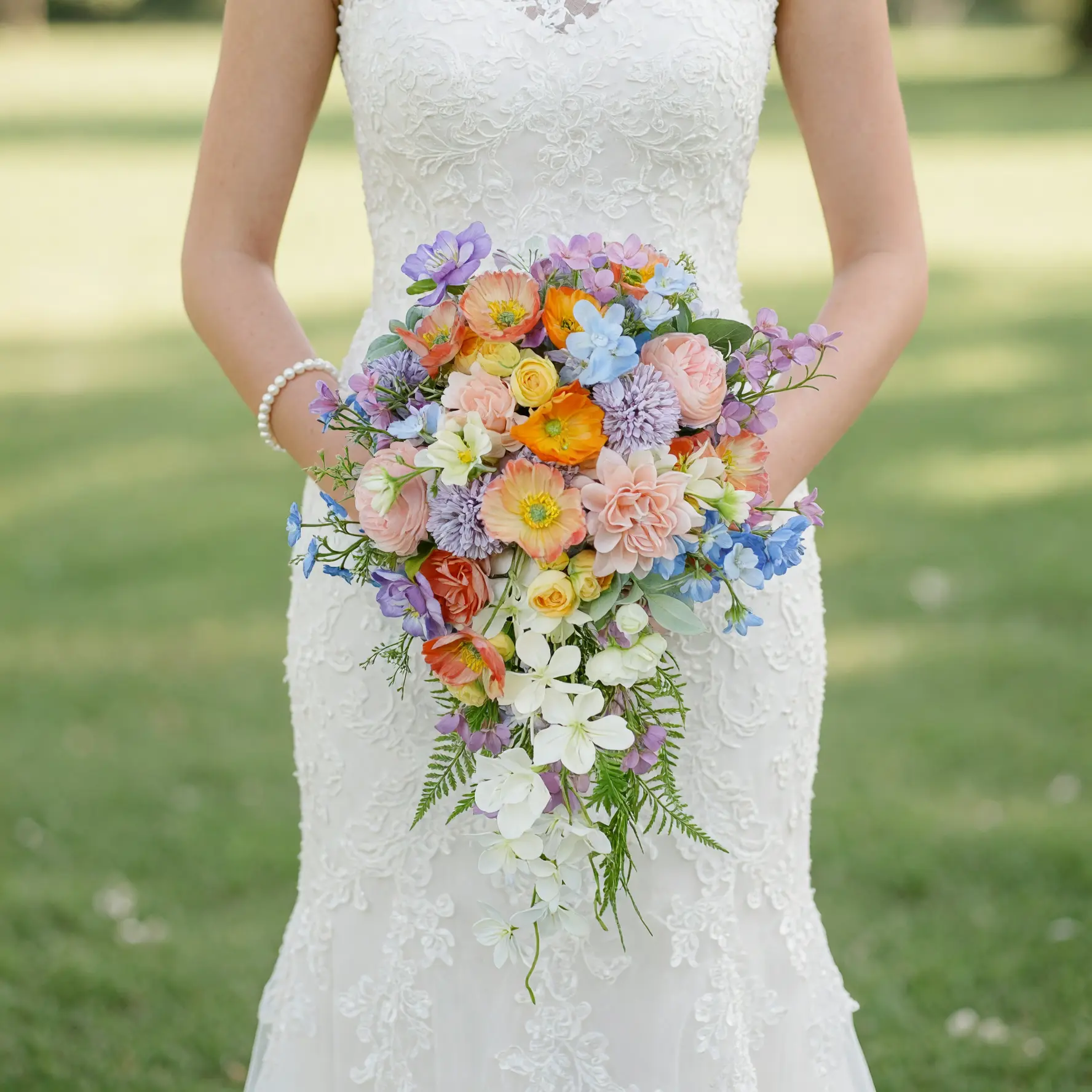 Popular wedding bouquets featuring colorful cascading roses, poppies, pastel blooms, and lush greenery for a romantic bridal wedding.