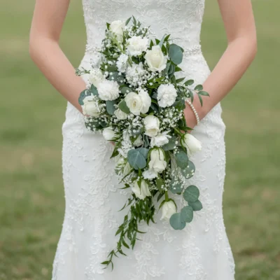Bridal flowers bouquets with white roses, baby's breath, cascading blooms and eucalyptus for a romantic wedding