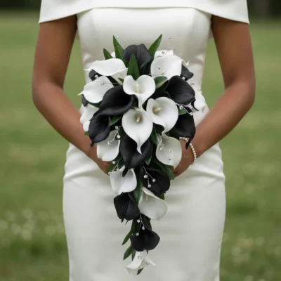 Bridal flowers bouquets with cascading black and white calla lilies, green foliage, and elegant crystal accents