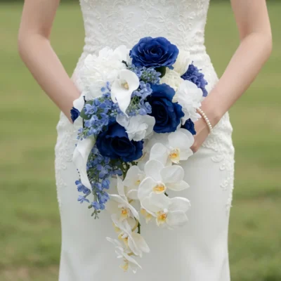 bridal flowers bouquets with navy blue roses white calla lilies cascading orchids and delicate blue flowers held by a bride
