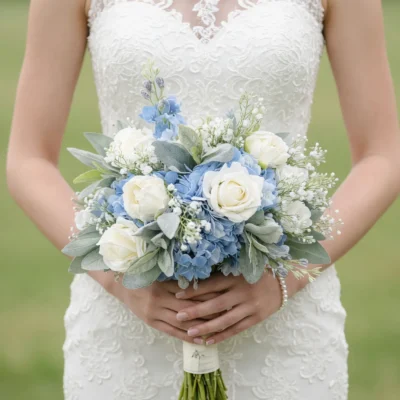Blue and white wedding bouquets with white roses blue hydrangeas and delicate greenery for a romantic bride