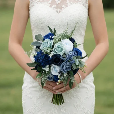 Blue bridal flowers bouquets with navy, sapphire, pale blue and white blooms, greenery, and romantic hand-tied wedding style