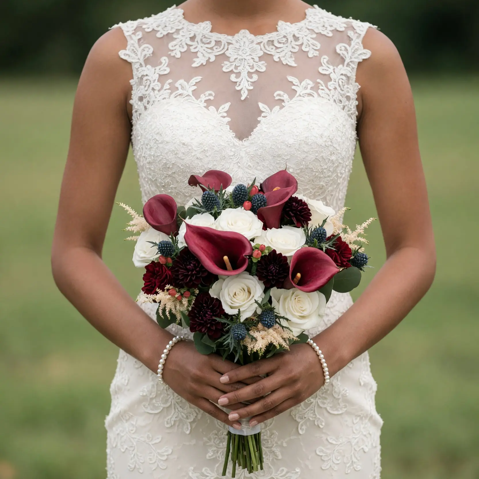 Popular wedding bouquets with burgundy calla lilies, white roses, dark red flowers, blue thistles and elegant greenery