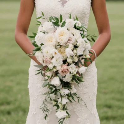 average price of bridal bouquet inspiration with ivory roses white flowers and cascading greenery for an elegant garden wedding