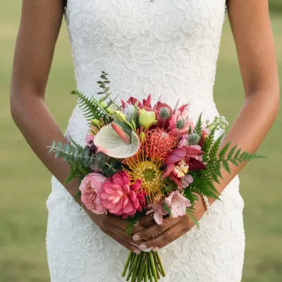 bridal flowers bouquets with coral protea blush roses creamy anthurium orchids pincushion flowers eucalyptus and fern for a tropical bride