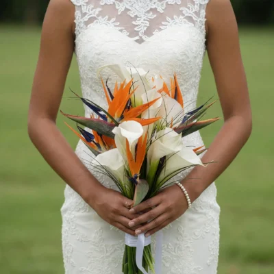 bridal flowers bouquets with white calla lilies orange bird of paradise blue accents fine grasses and tropical greenery